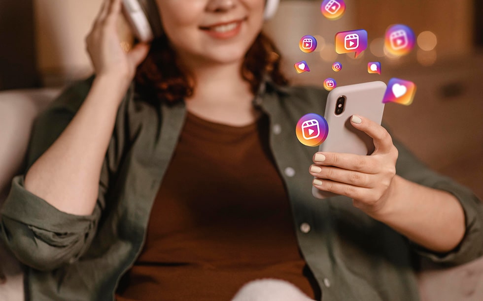 Woman listening to audio on phone surrounded by graphics of social media apps