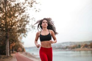 Woman running while listening to audio